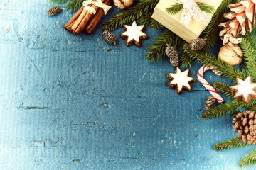 Christmas setting with candy cane, gingerbread cookies and fir branches