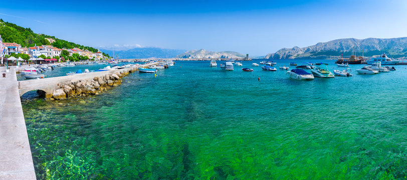 Wonderful romantic summer afternoon landscape panorama coastline Adriatic sea. Boats and yachts in harbor at cristal clear turquoise water. Baska on the island of Krk. © Sodel Vladyslav
