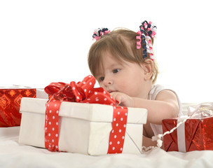 Cute baby girl  with gifts