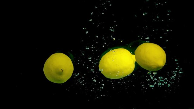 Lemons in slow motion in the water