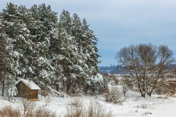 Country sauna in the snow, on the river Mologa in the winter.