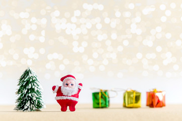 Christmas background. Santa Claus, christmas tree, and gift boxe