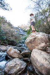 Obraz premium The man standing at Mae Ya Waterwall