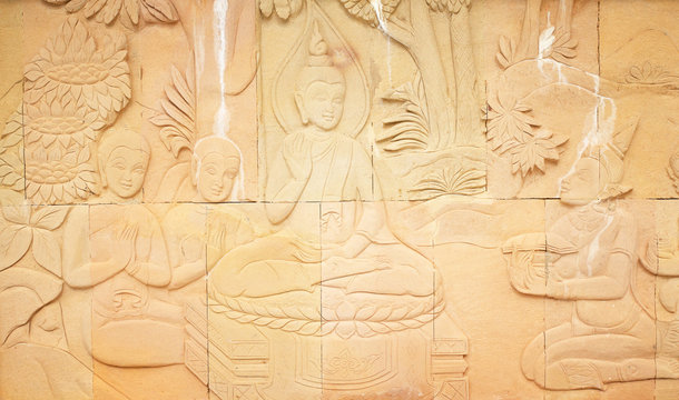 Carved Buddhist story on sandstone temple wall (At temple ,Thail