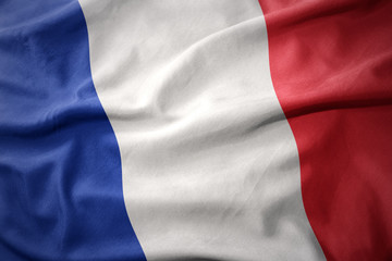 Naklejka premium macha kolorową flagą francji.