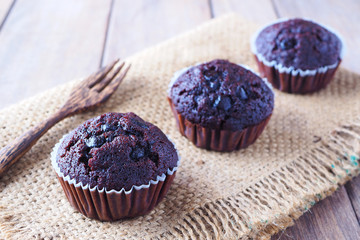 Close up of banana chocolate cupcakes on a sackcloth.
