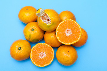 fresh and ripe oranges on blue backgrounds