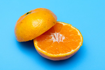 fresh and ripe oranges on blue backgrounds