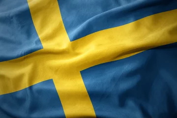 Fotobehang wuivende kleurrijke vlag van zweden. © luzitanija