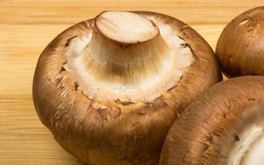mushroom champignons on a wooden Board