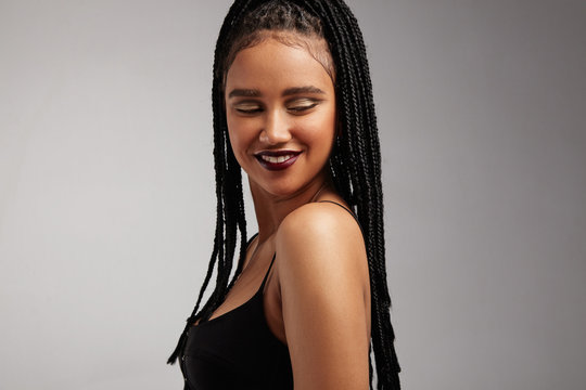 smiling woman with african braids
