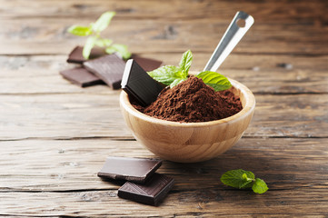 Dark chocolate and cacao on the wooden table