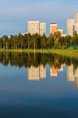 House reflected in lake at sunset light in Zelenograd district of Moscow, Russia