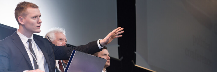 Young man in suit  during election campaign