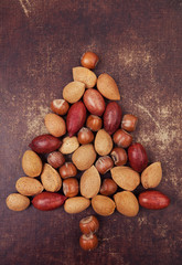 Various nuts arranged in a christmas tree shape