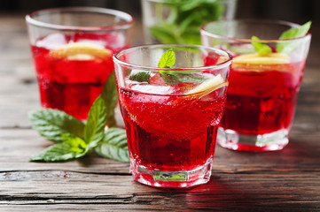 Aperitif with campari, mint and lemon