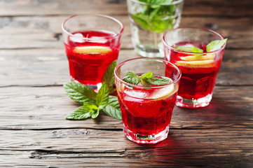 Aperitif with campari, mint and lemon