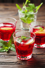 Aperitif with campari, mint and lemon