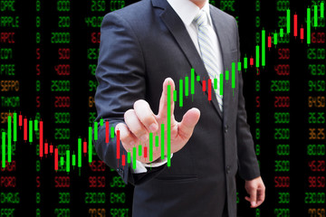 Businessman hand touching Candlestick Chart, investment concept