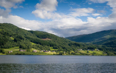 Norwegian village at fjord shore.