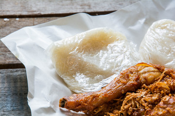 Fried chicken and sticky rice dinner on the wooden table