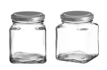 Empty glass jar isolated on white background