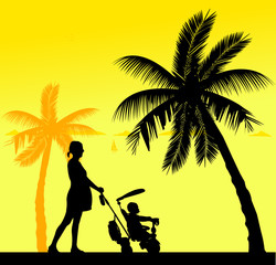 Pregnant woman walking with baby on a tricycle on the beach, one in the series of similar images silhouette