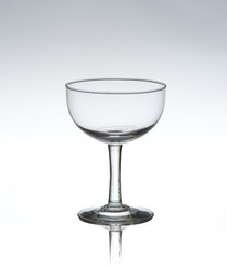 Empty cocktail glass on white background