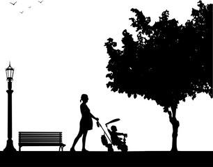 Pregnant woman walking with baby on a tricycle in park, one in the series of similar images silhouette