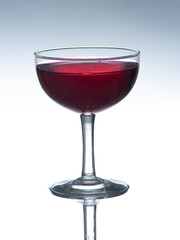 Red wine in glass isolated on white background