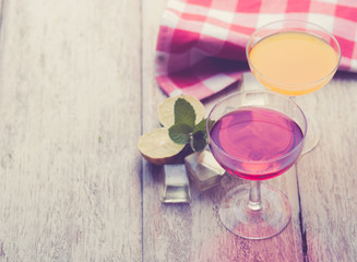 Various alcoholic cocktails on wood