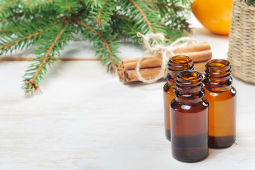 Essential oils in glass bottles  on wooden background
