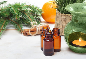 Essential oils in glass bottles  on wooden background