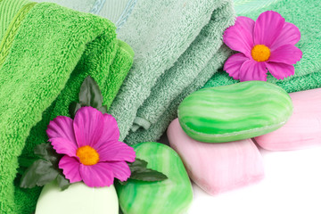 Towel, soaps and flowers