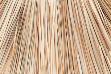 Wicker straw umbrellas closeup background