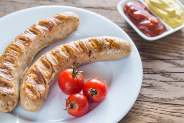 Grilled sausages with tomato and mustard sauce