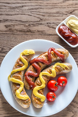 Grilled sausages with tomato and mustard sauce