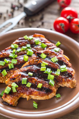Grilled pork steaks on the plate