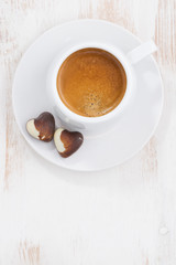 Fototapeta premium chocolate hearts and espresso, vertical, top view