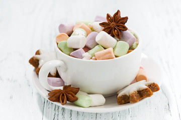 cocoa with colorful marshmallows and Christmas cookies