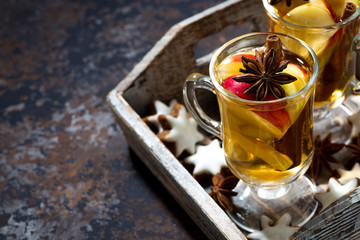 hot apple tea with spices and gingerbread cookies, top view