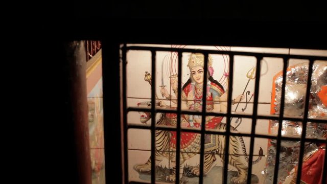 MS Painting of Hindu God behind window grill / India