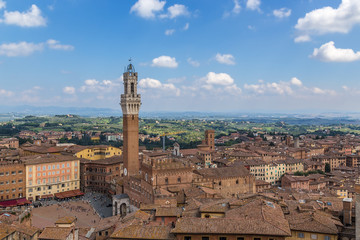 Fototapeta na wymiar Siena, Italy. Torre del Mangia (1348) and the view of the city with a bird's-eye view
