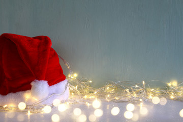 christmas garland warm lights next to santa hat