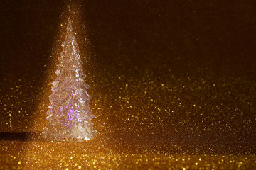 christmas glowing festive tree on glitter background