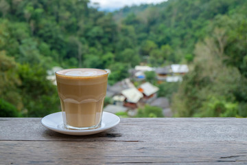Hot coffee on the wood.