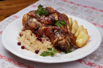 fried pork knuckle with potatoes and cabbage