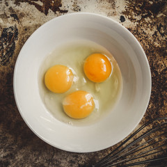 raw eggs in a bowl
