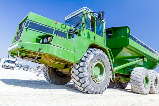 Close Up View On Dumper Truck While He Is Passing Over Construct