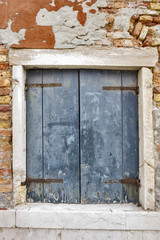 Venetian Old blue window at Murano island. Venice, Italy.